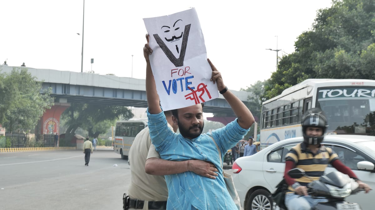 A protestor getting detained by Delhi Police.
