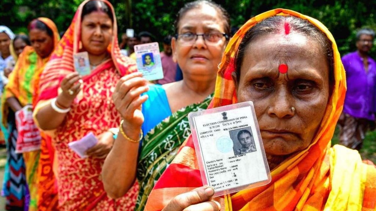 Indian voter holding an identity card