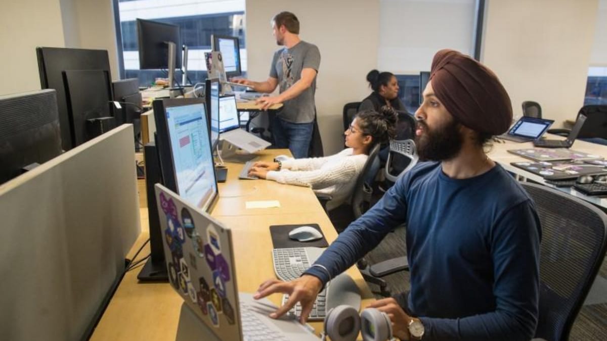 Microsoft employees working in an office
