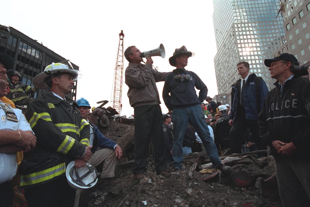 Courtesy: National Archives Foundation | President George W. Bush Addresses Approximately 400 Police, Firemen and Rescue Workers by Bullhorn at the Site of the Collapsed World Trade Center in New York City.