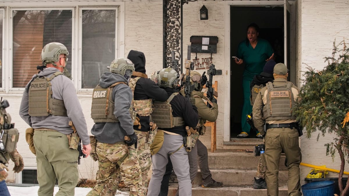 Armed police officers conduct a raid at a residential property in the United States